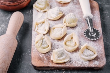 Fresh raw homemade tortellini or ravioli pasta