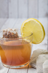 cup of tea with lemon on wooden table 