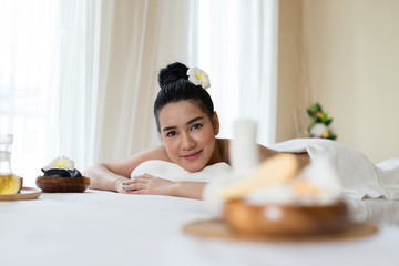 Obraz na płótnie Canvas Young beautiful Asian woman smile relaxing in the spa