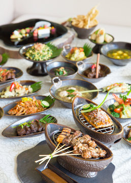 Indonesian cuisine - Many traditional Balinese dishes on the table, top view
