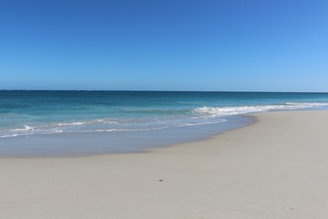 Fototapeta na wymiar Gorgeous beach with white sand and turquoise water under blue skies