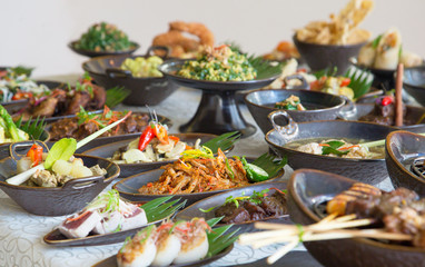 Indonesian cuisine - Many traditional Balinese dishes on the table, top view
