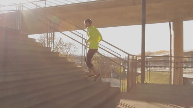 Urban jogger running on the stairs.