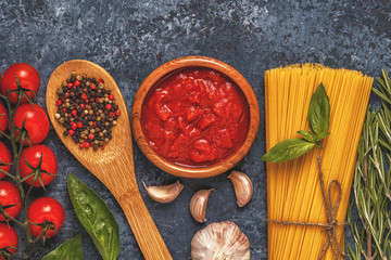 Italian food background with pasta, spices and vegetables.