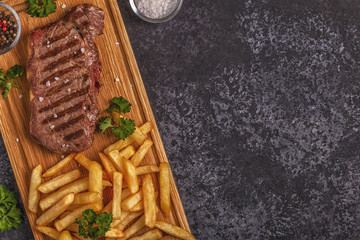 Beef barbecue steak with french fries.