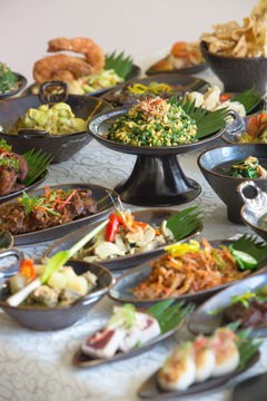 Indonesian cuisine - Many traditional Balinese dishes on the table, top view
