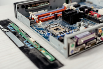 close up of computer motherboard and details on table