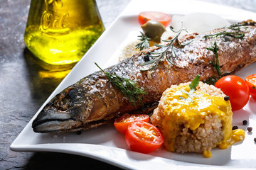 freshly grilled fish with vegetables and rice