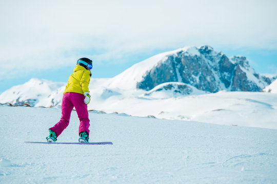 Picture of woman snowboarding on snowy slope