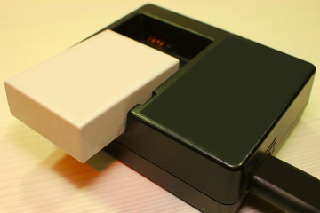 battery for the camera close-up on a light background