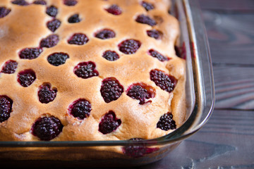 Cake with BlackBerry in a glass baking dish. Healthy home baking concept without sugar, with flour from the shelf, proper nutrition, diet, weight loss