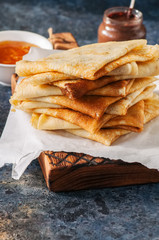 Freshly baked cheesy spinach bread on a white stone backdrop. Rustic style.