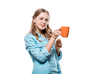 beautiful smiling girl in eyeglasses holding mug of tea isolated on white
