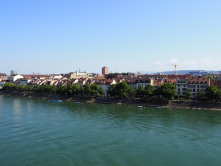 Obraz premium Bank on Rhine River in swiss city center of Basel in Switzerland with representative historical buildings