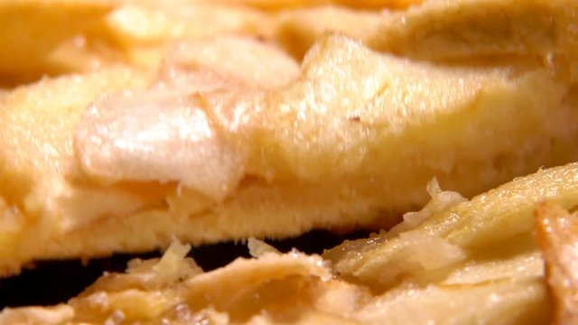 Close uo of a piece of apple pie taken from a plate