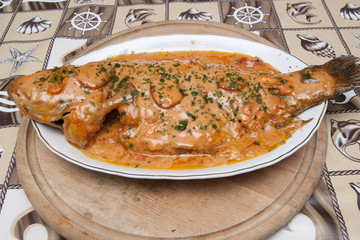 Carp with garlic sauce