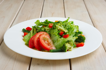 Fresh spring green salad, beans, tomato and broccoli
