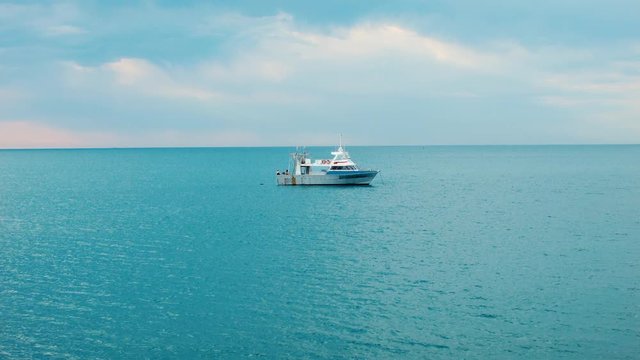 Boat On The Still Blue Ocean