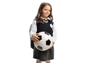 Little schoolgirl holding a football