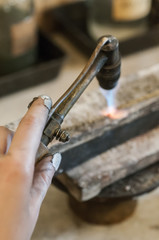 Craft jewelery making with flame torch