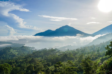 Mount Batur on the island of Bali. Rice fields. The photo is taken above the clouds.