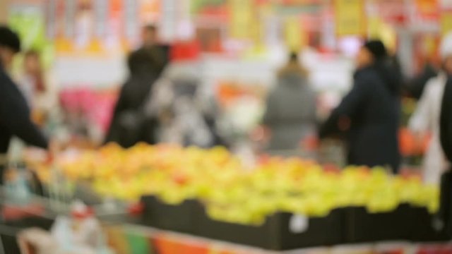 Customers in supermarket out of focus