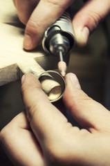 Fototapeta premium Craft jewelery making. Ring polishing. Macro shot.