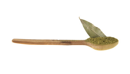 bay leaf in a wooden spoon isolated on a white background