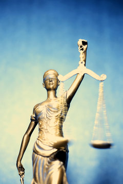 Lady Justice or Themis on blue background