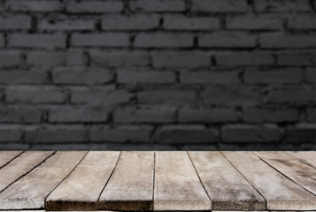 Selected focus empty wooden table and wall texture or old brick wall blur background image. for...