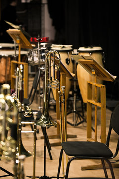Trombones on stage in Symphony orchestra in dark colors