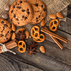 Cookies with nuts and spices on a wooden surface closeup