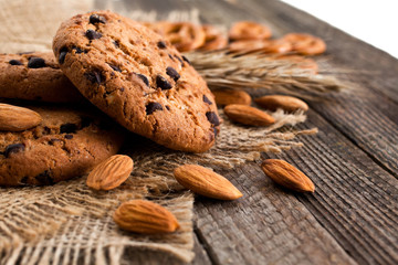  Cookies with nuts on a wooden surface closeup