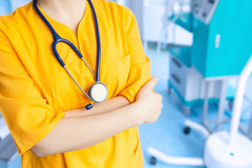 Concept doctor's background in yellow uniform in operating room