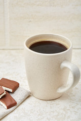 Cup of coffee and chocolate isolated on the white background, close-up.