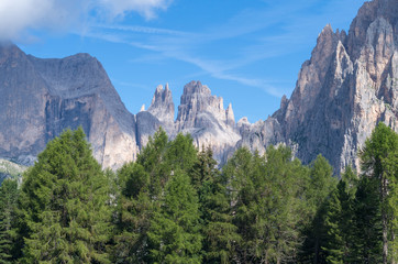 Obraz premium Catinaccio summit and Vajolet Towers seen from Ciamped e Refuge, above Vigo di Fassa village, Val di Fassa, Catinaccio mountain