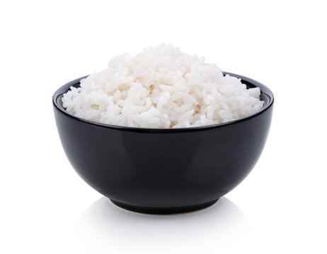 rice in black bowl on white background