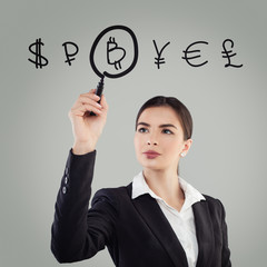 Businesswoman with Bitcoin symbol. Blockchain Transfers Concept on Gray Background