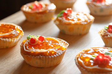 Orange cake on wood table.