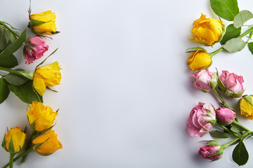 Elegant feminine mockup with small spring roses on white background with text space