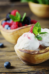 Fresh fruit ice cream with mint on the wooden background