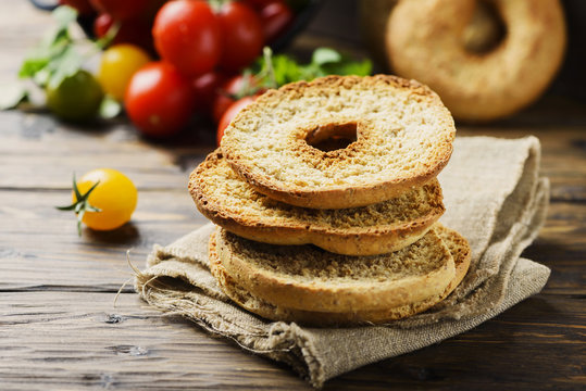 Traditional italian bread frisella on the wooden table