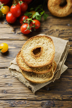 Traditional italian bread frisella on the wooden table