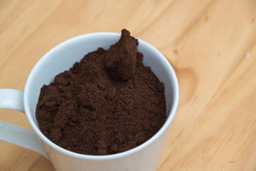 Coffee grounds in a cup on a table 