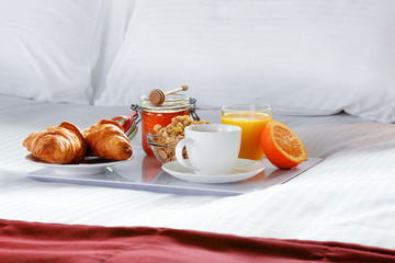 Breakfast in bed in hotel room.
