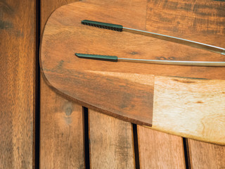 flat lay from wooden chopping board and kitchen equipment put on outdoor table background