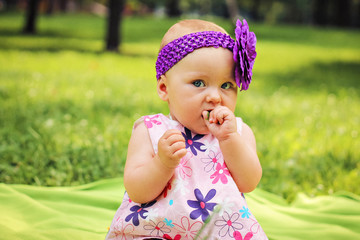 cute little girl with green leaf in hand