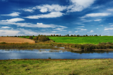 autumn day. the picturesque sky above the river