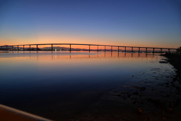 Fototapeta na wymiar The Sunrise over the Coronado Bridge in San Diego, California.