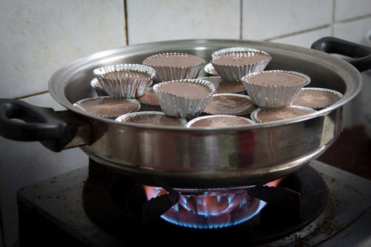Making of a cream chocolate cakes for home-made at home.